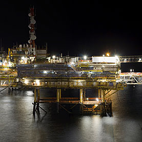 Offshore Oil Drilling Platform at Night